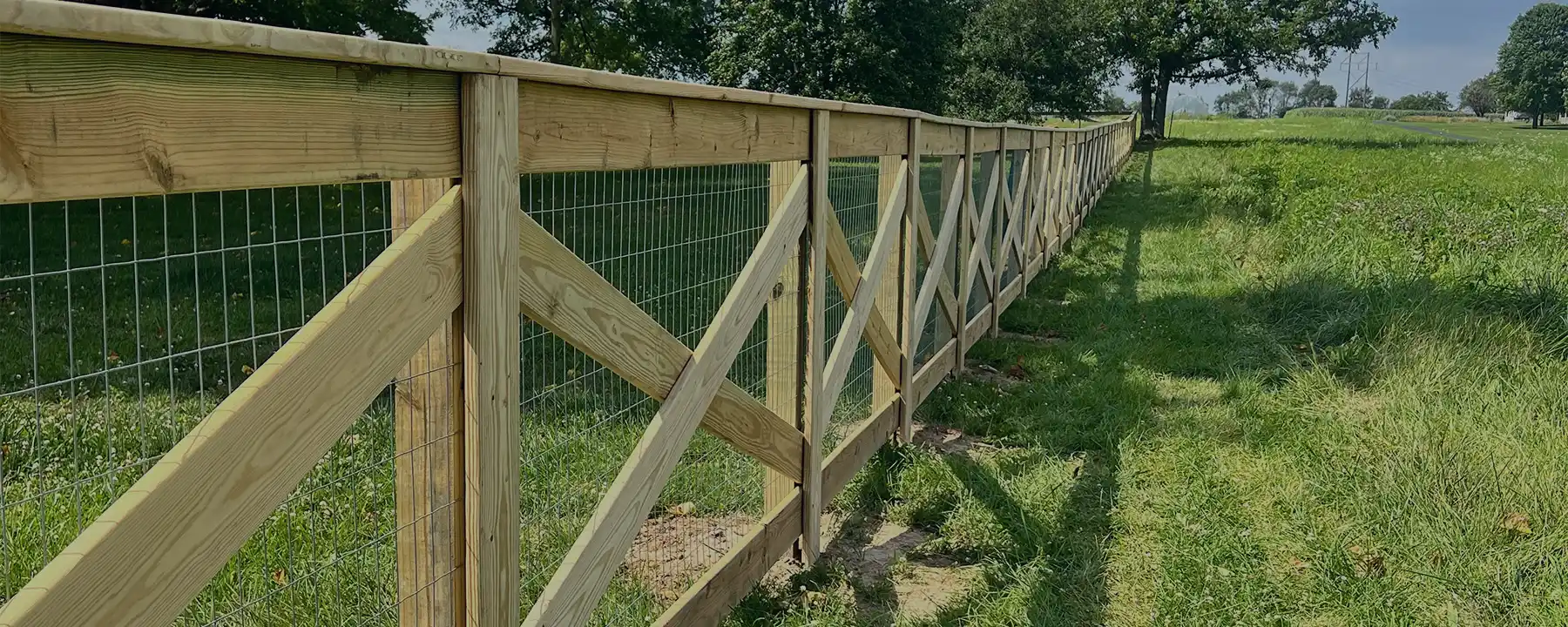 crossbuck farm fence with wire mesh installed by Indy's Finest Fence in Indianapolis Indiana